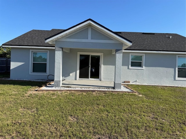 468 Marion Oaks Blvd, Ocala, FL 34473 - back of house with a yard, a shingled roof, and stucco siding