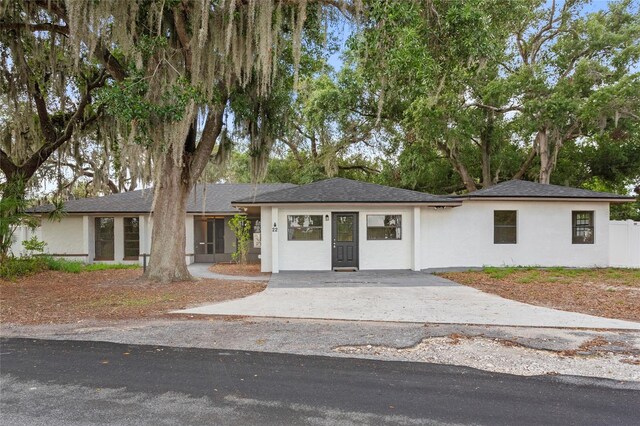 22 Hillcrest Dr, Babson Park, FL 33827 - view of front of home with concrete driveway and stucco siding