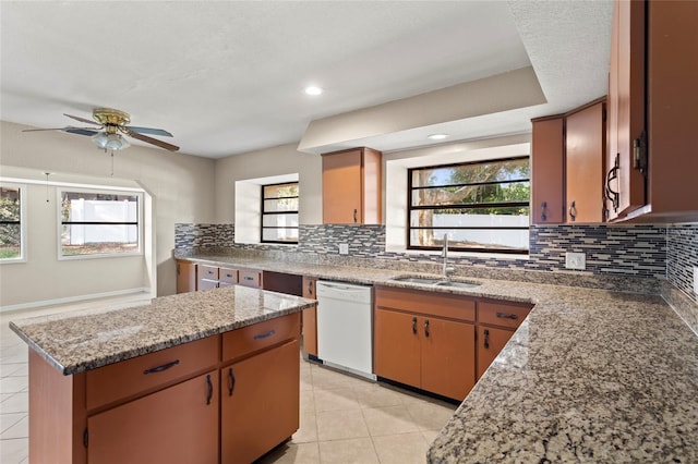 22 Hillcrest Dr, Babson Park, FL 33827 - kitchen featuring dishwasher, a sink, backsplash, light tile patterned flooring, and recessed lighting