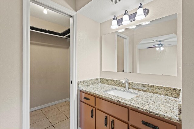 22 Hillcrest Dr, Babson Park, FL 33827 - bathroom featuring tile patterned flooring, vanity, ceiling fan, and baseboards