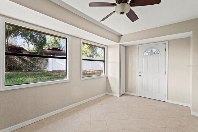 22 Hillcrest Dr, Babson Park, FL 33827 - entrance foyer featuring baseboards, ceiling fan, and light tile patterned floors