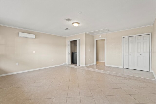 22 Hillcrest Dr, Babson Park, FL 33827 - unfurnished bedroom featuring attic access, a wall mounted AC, light tile patterned floors, crown molding, and baseboards