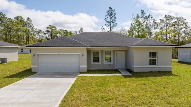 9825 N Swanee Ter, Dunnellon, FL 34433 - ranch-style home featuring an attached garage, concrete driveway, stucco siding, a front yard, and central AC