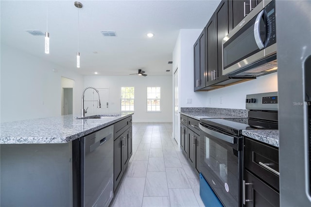9825 N Swanee Ter, Dunnellon, FL 34433 - kitchen featuring appliances with stainless steel finishes, a sink, decorative light fixtures, ceiling fan, and recessed lighting