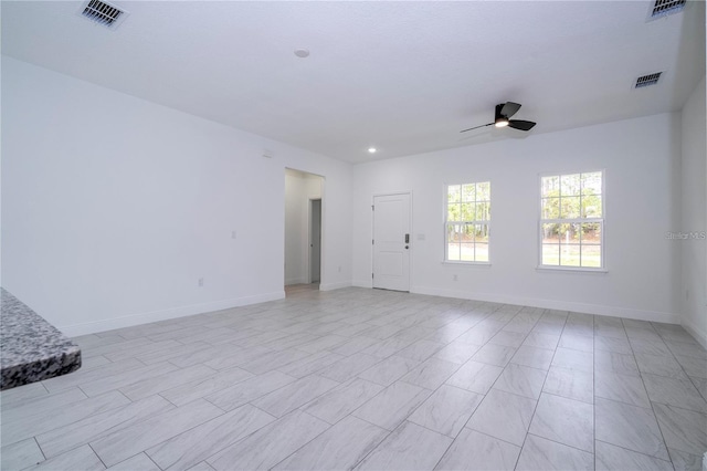 9825 N Swanee Ter, Dunnellon, FL 34433 - empty room featuring a ceiling fan, baseboards, and recessed lighting