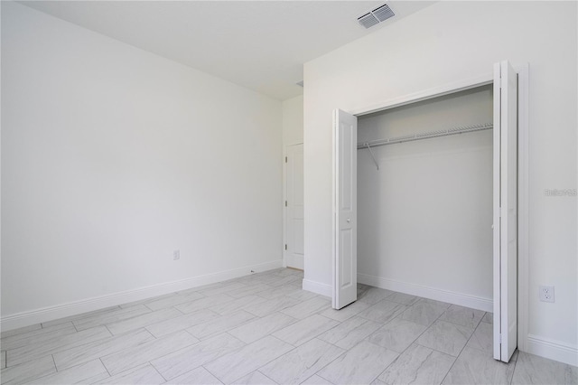 9825 N Swanee Ter, Dunnellon, FL 34433 - unfurnished bedroom with a closet and baseboards