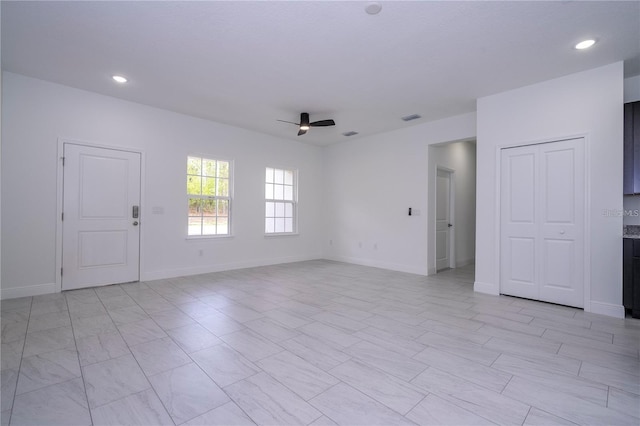 9825 N Swanee Ter, Dunnellon, FL 34433 - empty room featuring ceiling fan, baseboards, and recessed lighting