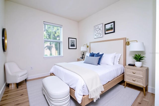 25 W 7th St, Apopka, FL 32703 - bedroom featuring light wood-style floors and baseboards