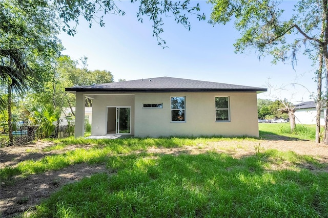 25 W 7th St, Apopka, FL 32703 - rear view of house featuring stucco siding