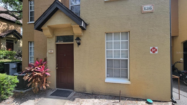 6316 Raleigh St Unit 401, Orlando, FL 32835 - entrance to property featuring stucco siding