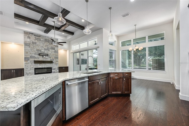 25859 Crossings Bluff Ln, Sorrento, FL 32776 - kitchen with stainless steel appliances, a sink, ceiling fan, coffered ceiling, and open floor plan