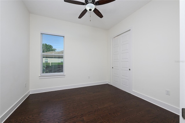 25859 Crossings Bluff Ln, Sorrento, FL 32776 - empty room featuring dark wood finished floors, ceiling fan, and baseboards