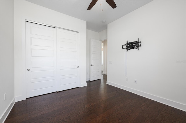 25859 Crossings Bluff Ln, Sorrento, FL 32776 - unfurnished bedroom featuring dark wood-type flooring, baseboards, a closet, and ceiling fan