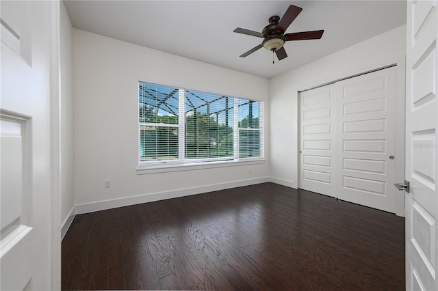 25859 Crossings Bluff Ln, Sorrento, FL 32776 - unfurnished bedroom with dark wood finished floors, baseboards, a closet, and ceiling fan