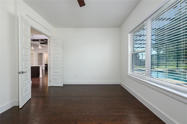 25859 Crossings Bluff Ln, Sorrento, FL 32776 - spare room with ceiling fan, dark wood finished floors, and baseboards