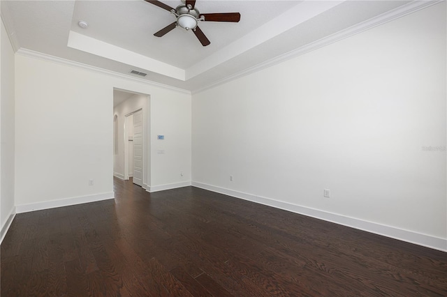 25859 Crossings Bluff Ln, Sorrento, FL 32776 - spare room featuring a tray ceiling, a ceiling fan, dark wood-style flooring, baseboards, and ornamental molding