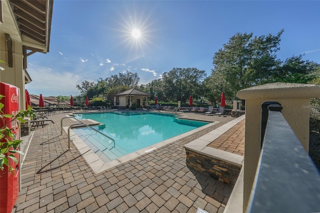 25859 Crossings Bluff Ln, Sorrento, FL 32776 - community pool with a patio area