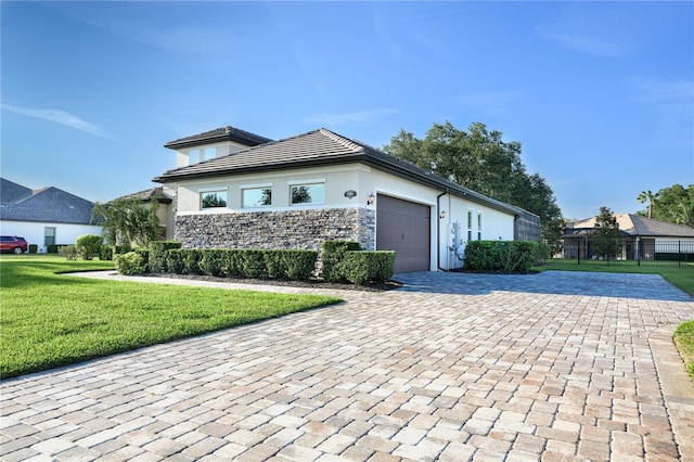 25859 Crossings Bluff Ln, Sorrento, FL 32776 - view of front facade with decorative driveway, stucco siding, an attached garage, and stone siding