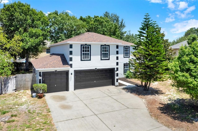 809 Deer Glen Ct, Fruitland Park, FL 34731 - view of front facade with stucco siding, concrete driveway, a shingled roof, and an attached garage