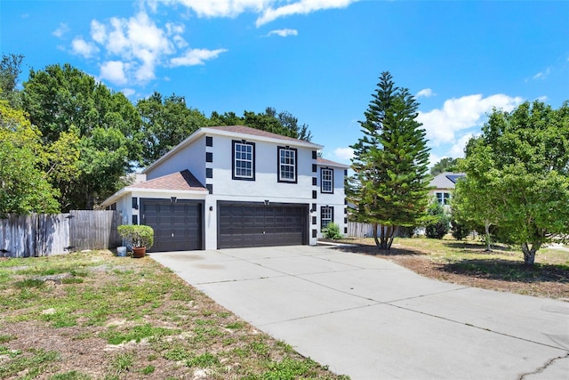 809 Deer Glen Ct, Fruitland Park, FL 34731 - view of front facade with stucco siding, concrete driveway, a garage, and an attached garage
