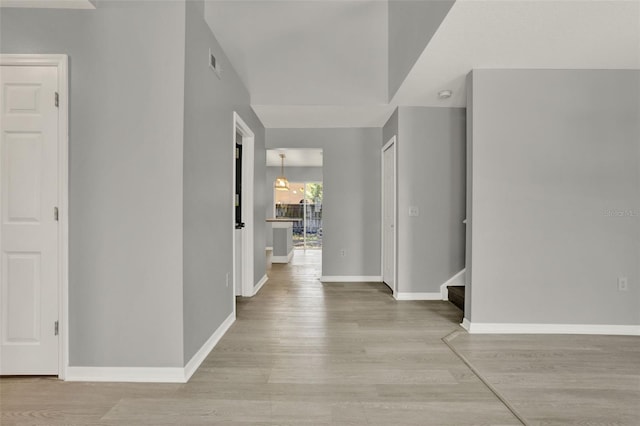 809 Deer Glen Ct, Fruitland Park, FL 34731 - foyer entrance with light wood-style floors, baseboards, and stairs