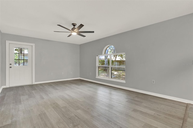 809 Deer Glen Ct, Fruitland Park, FL 34731 - empty room featuring plenty of natural light, ceiling fan, and wood finished floors