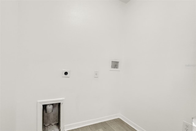 809 Deer Glen Ct, Fruitland Park, FL 34731 - washroom featuring electric dryer hookup, hookup for a washing machine, light wood-style floors, and baseboards