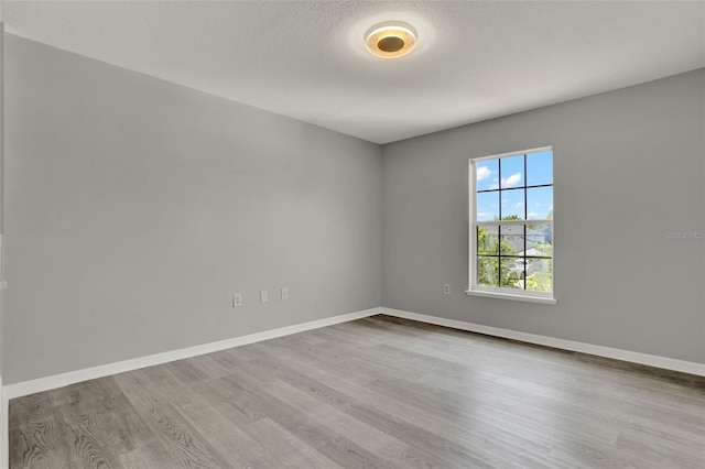 809 Deer Glen Ct, Fruitland Park, FL 34731 - spare room featuring wood finished floors and baseboards
