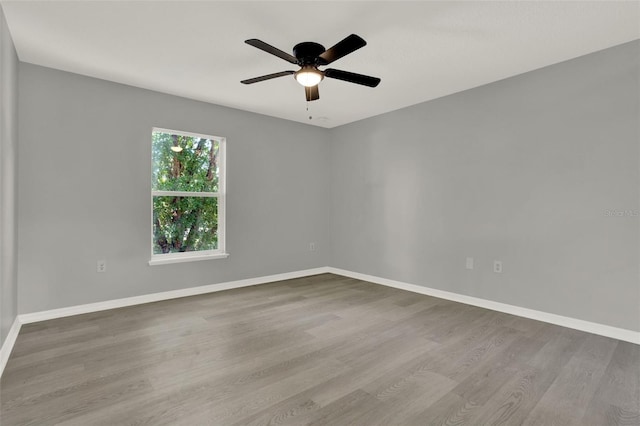 809 Deer Glen Ct, Fruitland Park, FL 34731 - unfurnished room featuring wood finished floors, ceiling fan, and baseboards