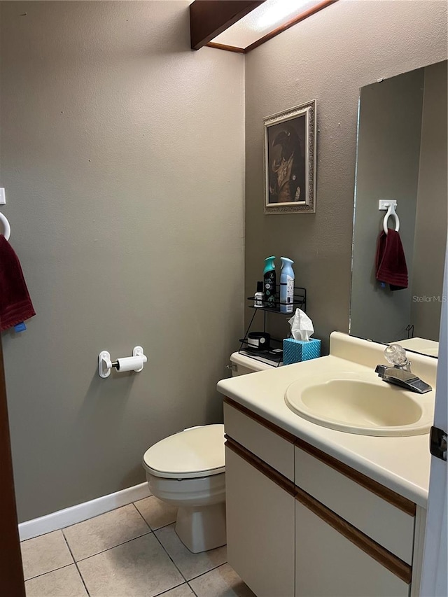 707 Carpenters Way Unit 50, Lakeland, FL 33809 - half bathroom featuring toilet, vanity, and tile patterned flooring