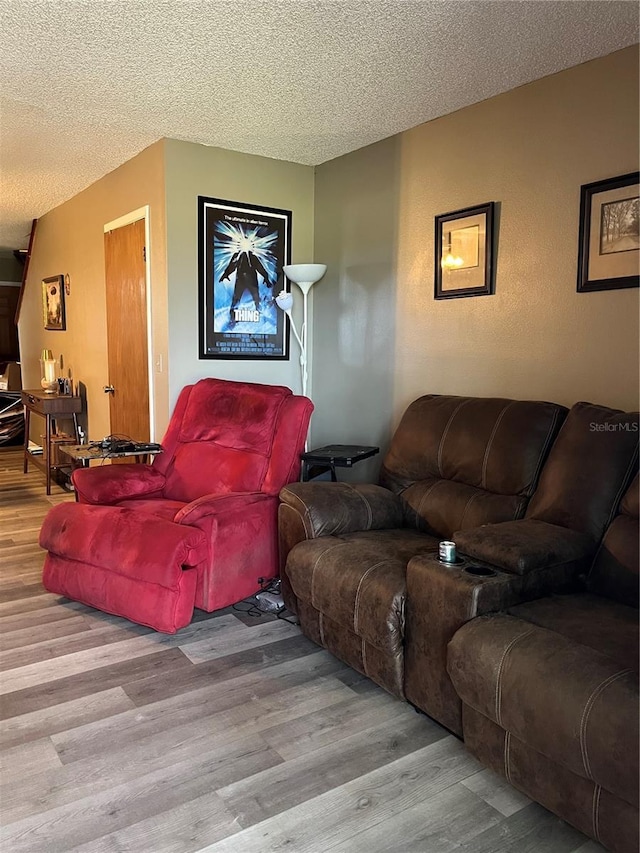 707 Carpenters Way Unit 50, Lakeland, FL 33809 - living area with wood finished floors and a textured ceiling