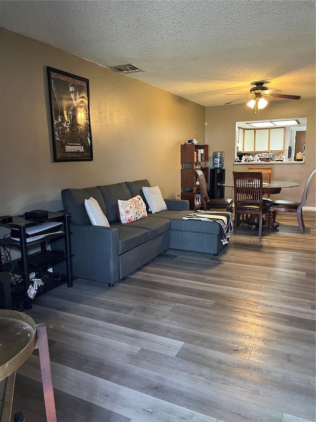 707 Carpenters Way Unit 50, Lakeland, FL 33809 - living area featuring ceiling fan, a textured ceiling, and wood finished floors