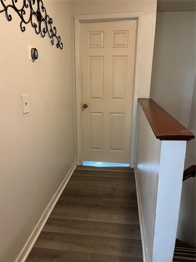 707 Carpenters Way Unit 50, Lakeland, FL 33809 - hall featuring baseboards and dark wood-type flooring