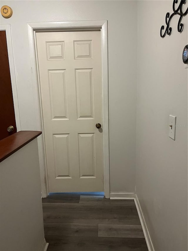 707 Carpenters Way Unit 50, Lakeland, FL 33809 - doorway to outside featuring dark wood finished floors and baseboards