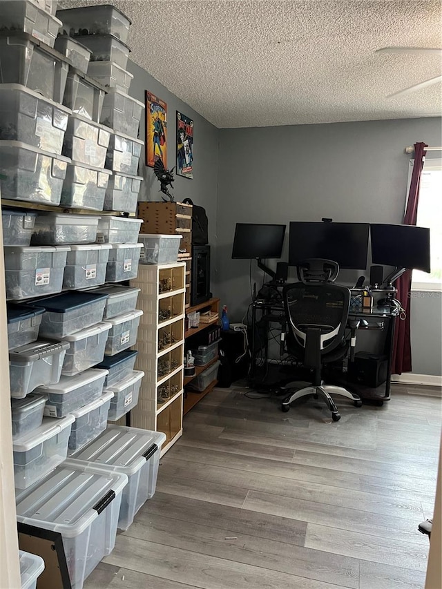 707 Carpenters Way Unit 50, Lakeland, FL 33809 - office area featuring a textured ceiling and wood finished floors