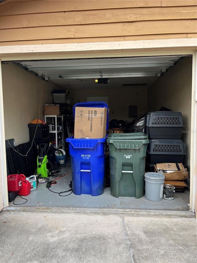 707 Carpenters Way Unit 50, Lakeland, FL 33809 - garage featuring a garage door opener