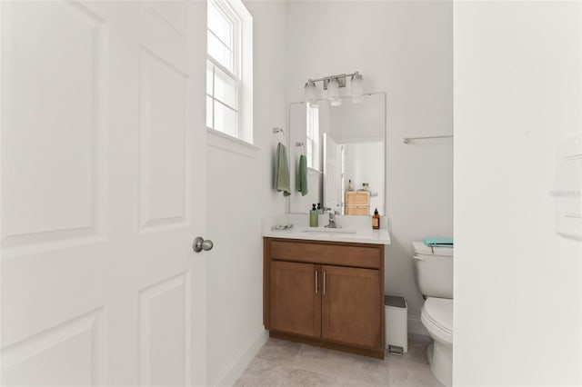 701 Dennis Ave, Orlando, FL 32807 - bathroom with vanity, toilet, and baseboards
