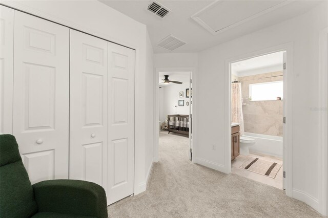 701 Dennis Ave, Orlando, FL 32807 - hallway featuring light colored carpet and baseboards