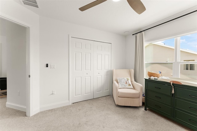 701 Dennis Ave, Orlando, FL 32807 - living area featuring light carpet, ceiling fan, and baseboards