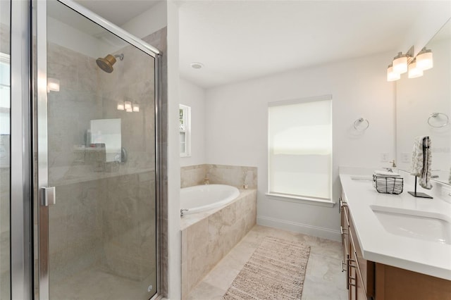 701 Dennis Ave, Orlando, FL 32807 - full bathroom featuring double vanity, a garden tub, and a stall shower