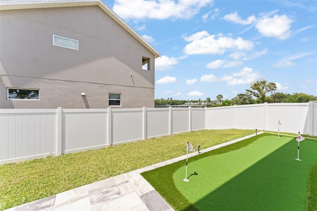 701 Dennis Ave, Orlando, FL 32807 - view of yard with a putting area