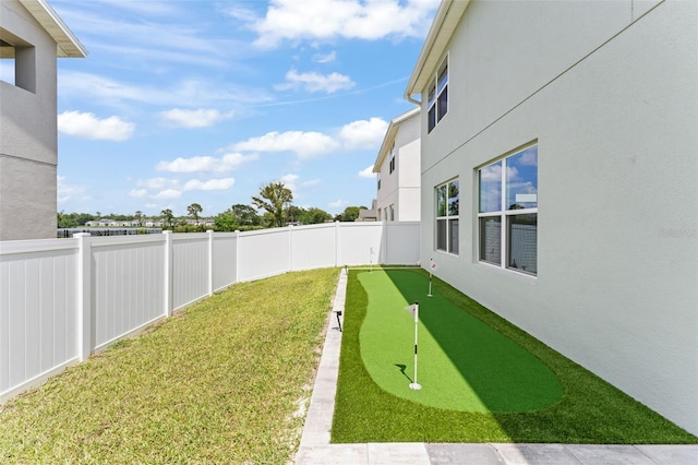 701 Dennis Ave, Orlando, FL 32807 - view of yard with an area to practice putting