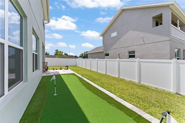 701 Dennis Ave, Orlando, FL 32807 - fenced backyard featuring a putting area