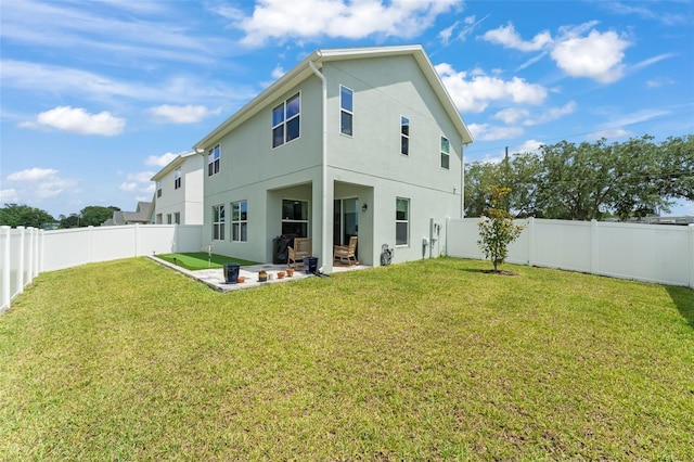 701 Dennis Ave, Orlando, FL 32807 - back of property with a patio area and stucco siding