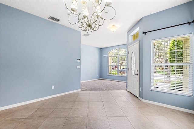 9644 Myrtle Creek Ln, Orlando, FL 32832 - tiled empty room with a chandelier and baseboards