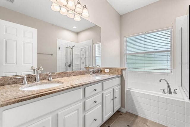 9644 Myrtle Creek Ln, Orlando, FL 32832 - bathroom featuring double vanity, a stall shower, a garden tub, and tile patterned floors