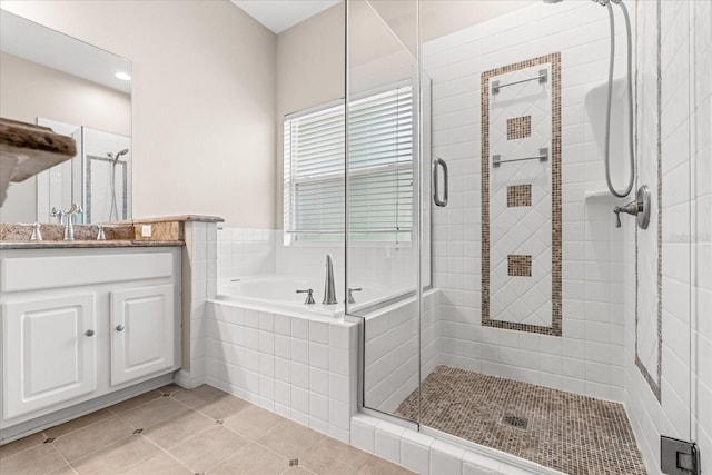 9644 Myrtle Creek Ln, Orlando, FL 32832 - full bathroom featuring a shower stall, vanity, tile patterned flooring, and a bath