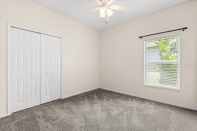 9644 Myrtle Creek Ln, Orlando, FL 32832 - unfurnished bedroom with carpet, a closet, baseboards, and ceiling fan