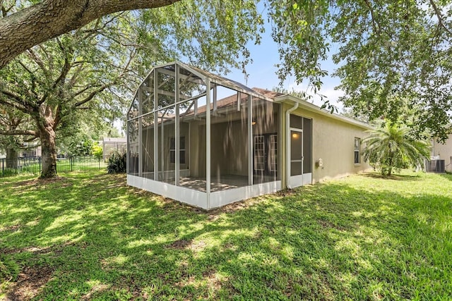 9644 Myrtle Creek Ln, Orlando, FL 32832 - back of house featuring central AC and stucco siding