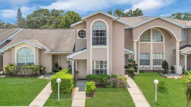 1642 Windsor Oak Ct, Kissimmee, FL 34744 - multi unit property with stucco siding and a front lawn